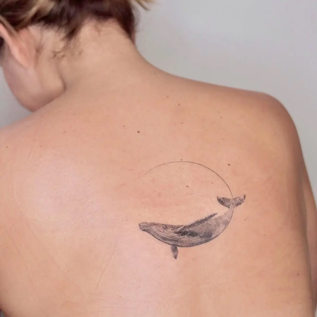 Elegant whale tattoo with minimalist design concept