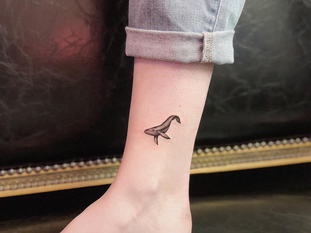 Charming Minimalist Whale Tattoo on the Arm