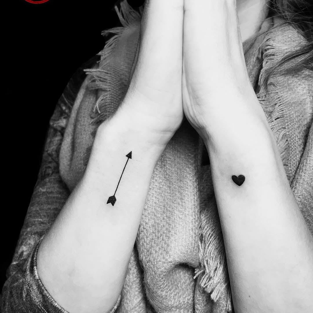 Stylish arrow and heart wrist tattoos design