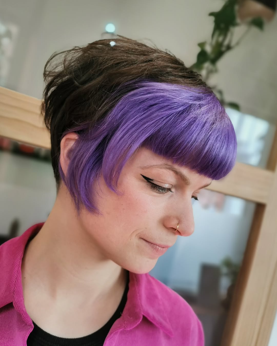 Trendy Pixie Cut with Vibrant Purple Highlights