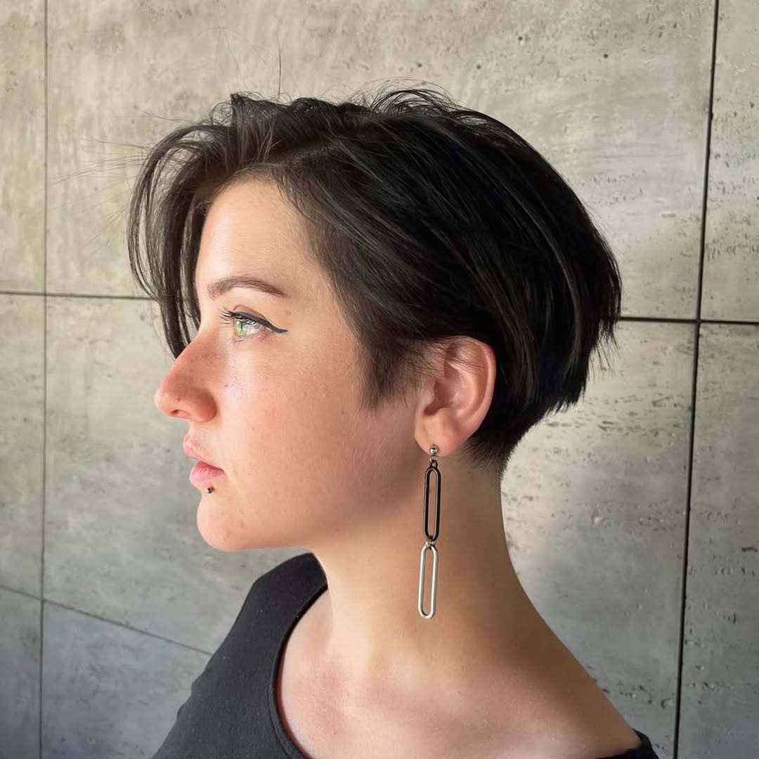 Chic Pixie Bob Haircut with Statement Earrings