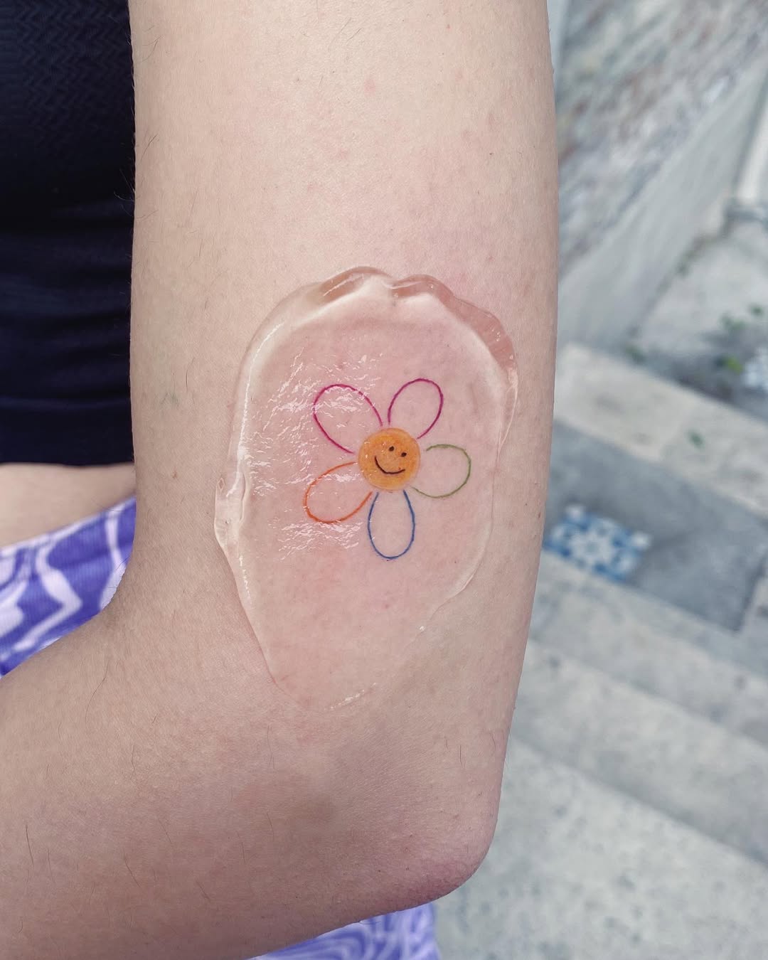 Vibrant Rainbow Flower Tattoo Inspiration