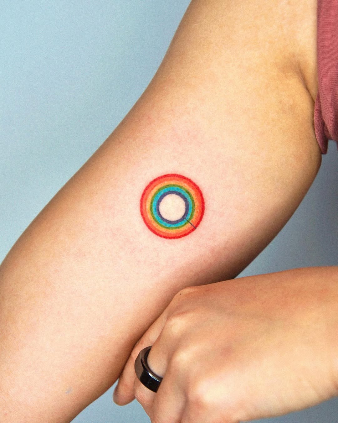 Vibrant Rainbow Circle Tattoo on Arm