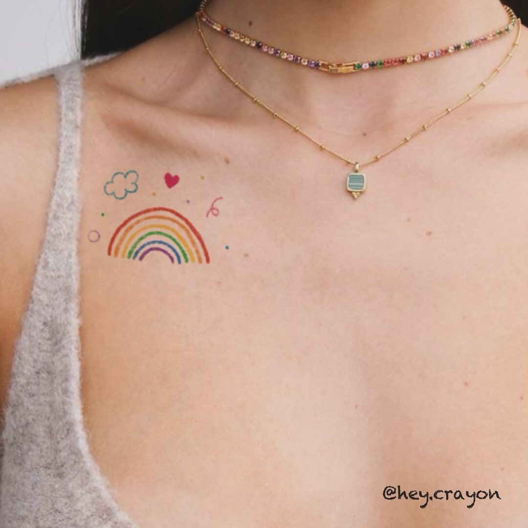 Charming Rainbow Tattoo with Playful Elements