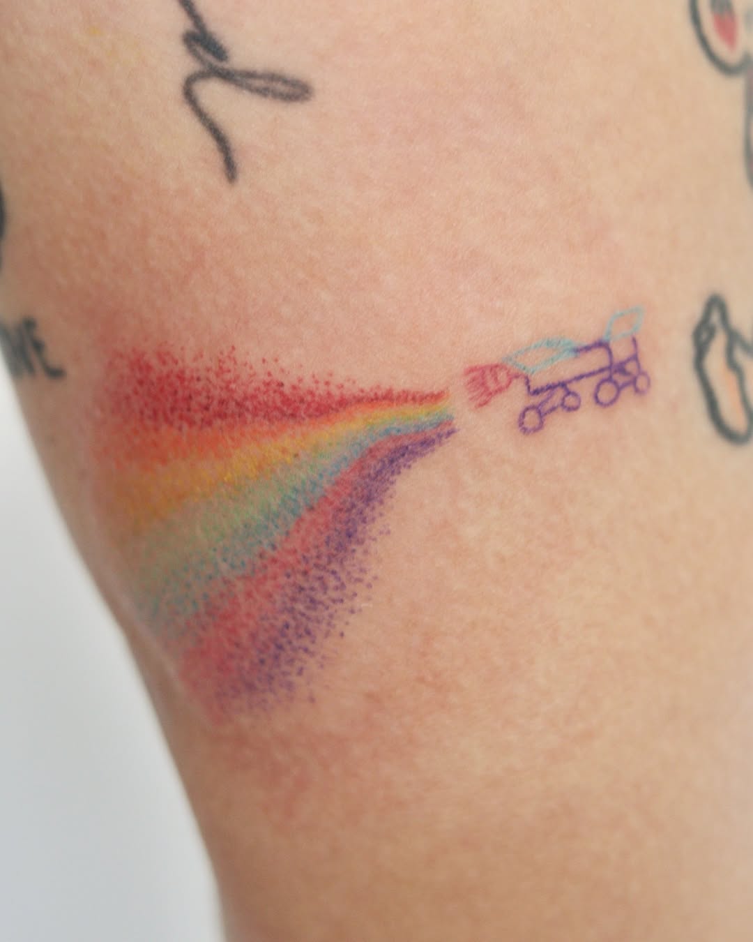 Colorful Rainbow Tattoo with Skateboard