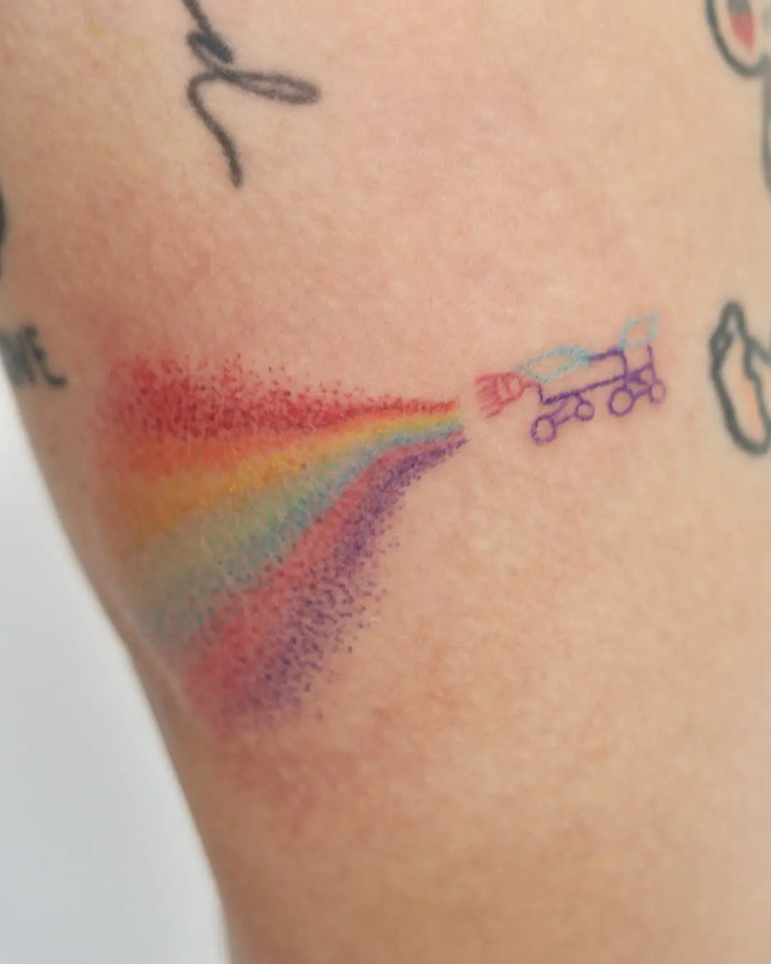 Colorful Rainbow Tattoo with Skateboard