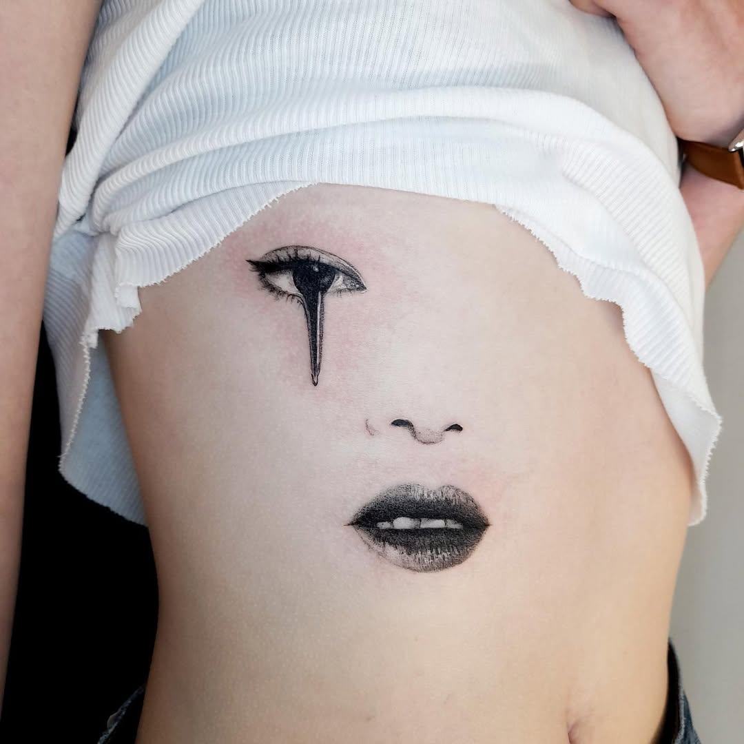 Captivating Rib Tattoo with Artistic Expression