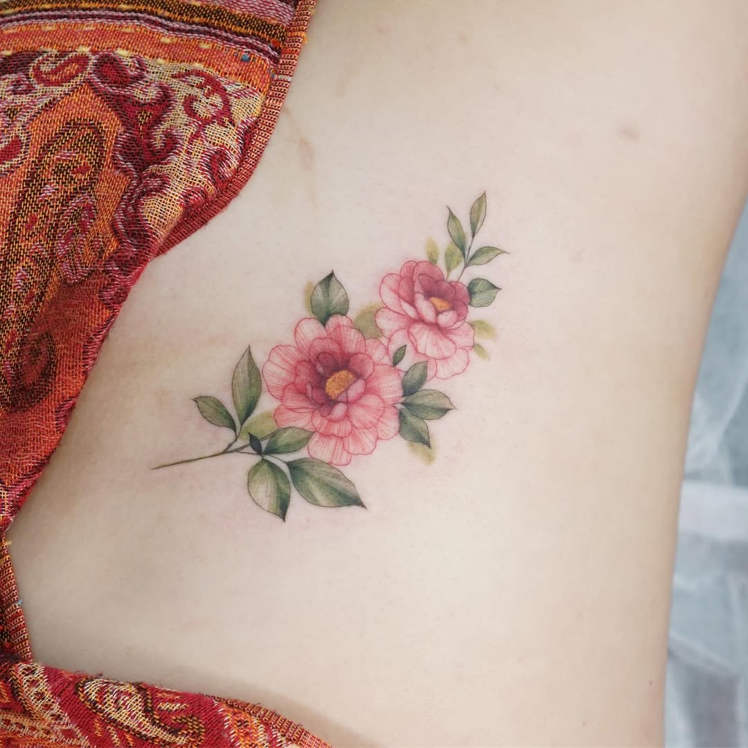 Elegant Floral Rib Tattoo Design Inspiration