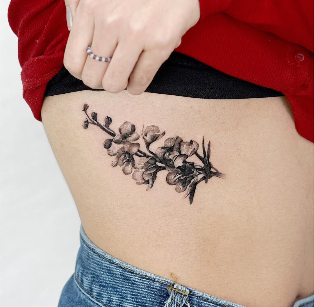 Elegant Floral Rib Tattoo for Body Art