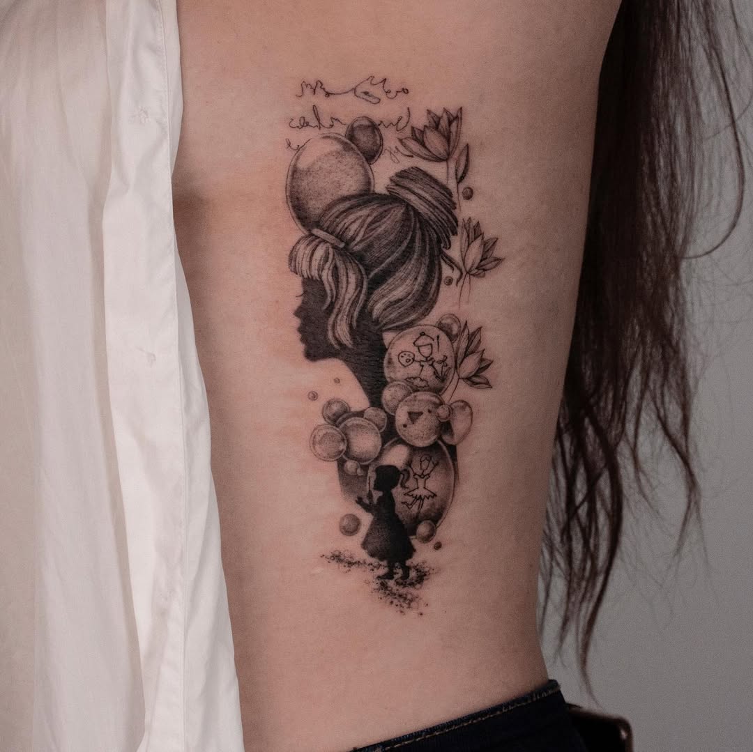 Elegant Rib Tattoo Featuring Silhouettes and Flowers