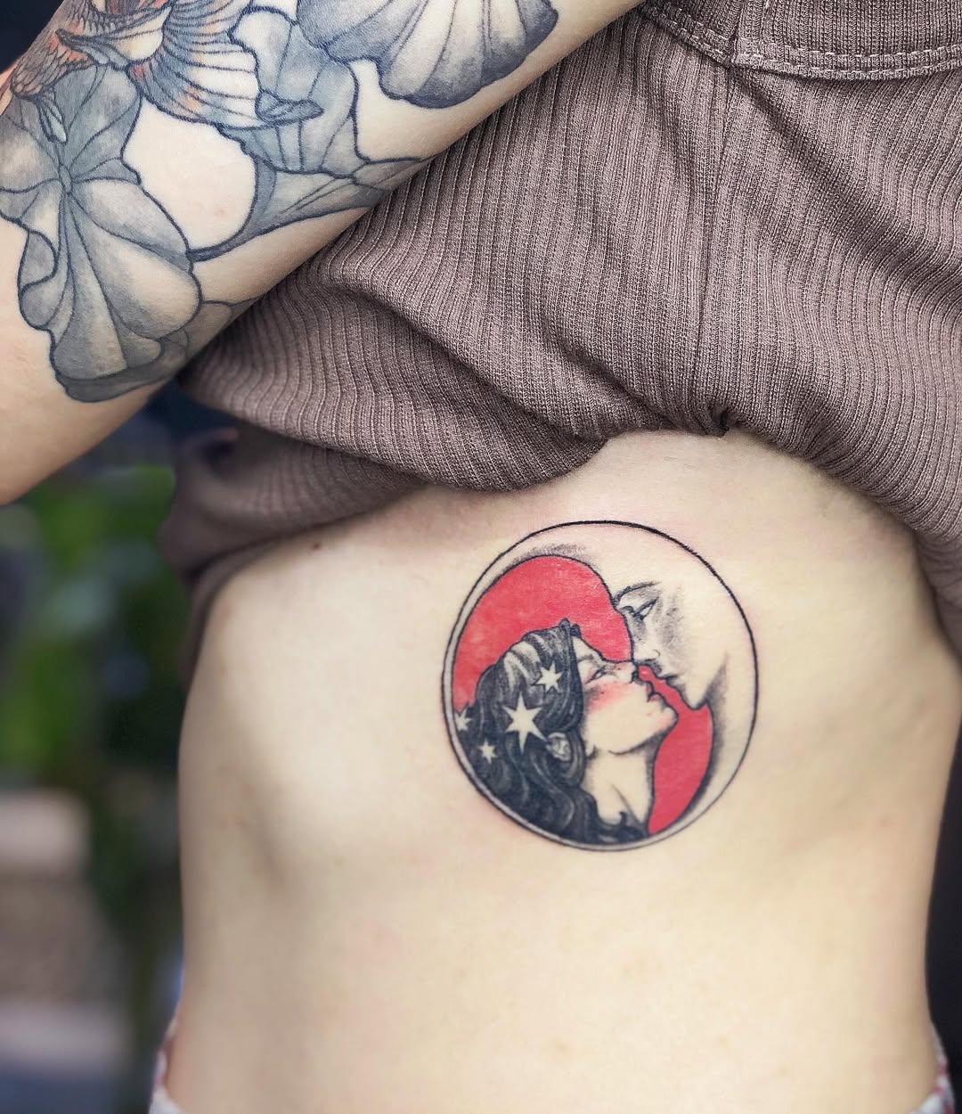 Romantic Rib Tattoo Featuring Moon and Kiss