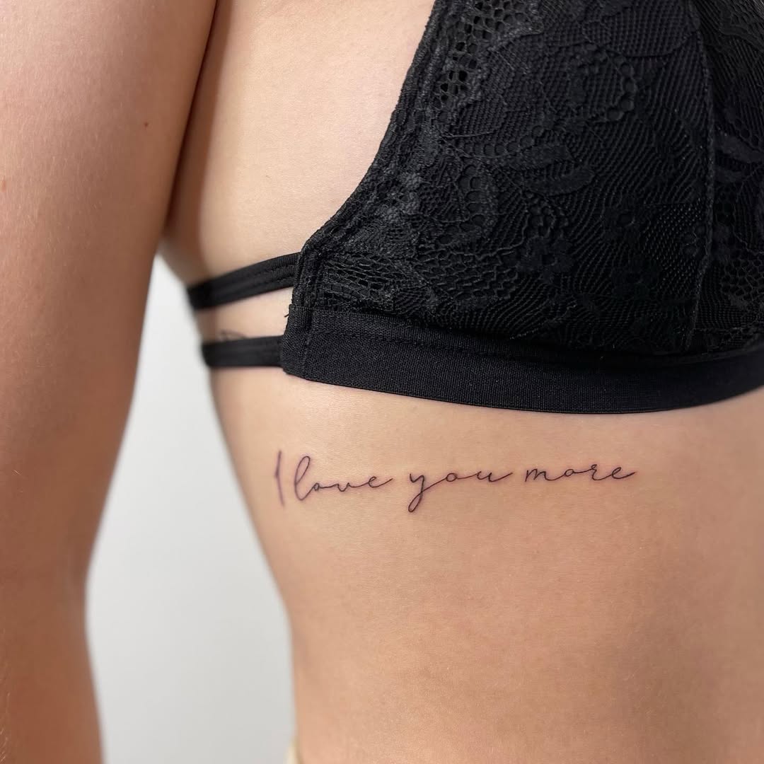 Elegant Rib Tattoo: Love You More