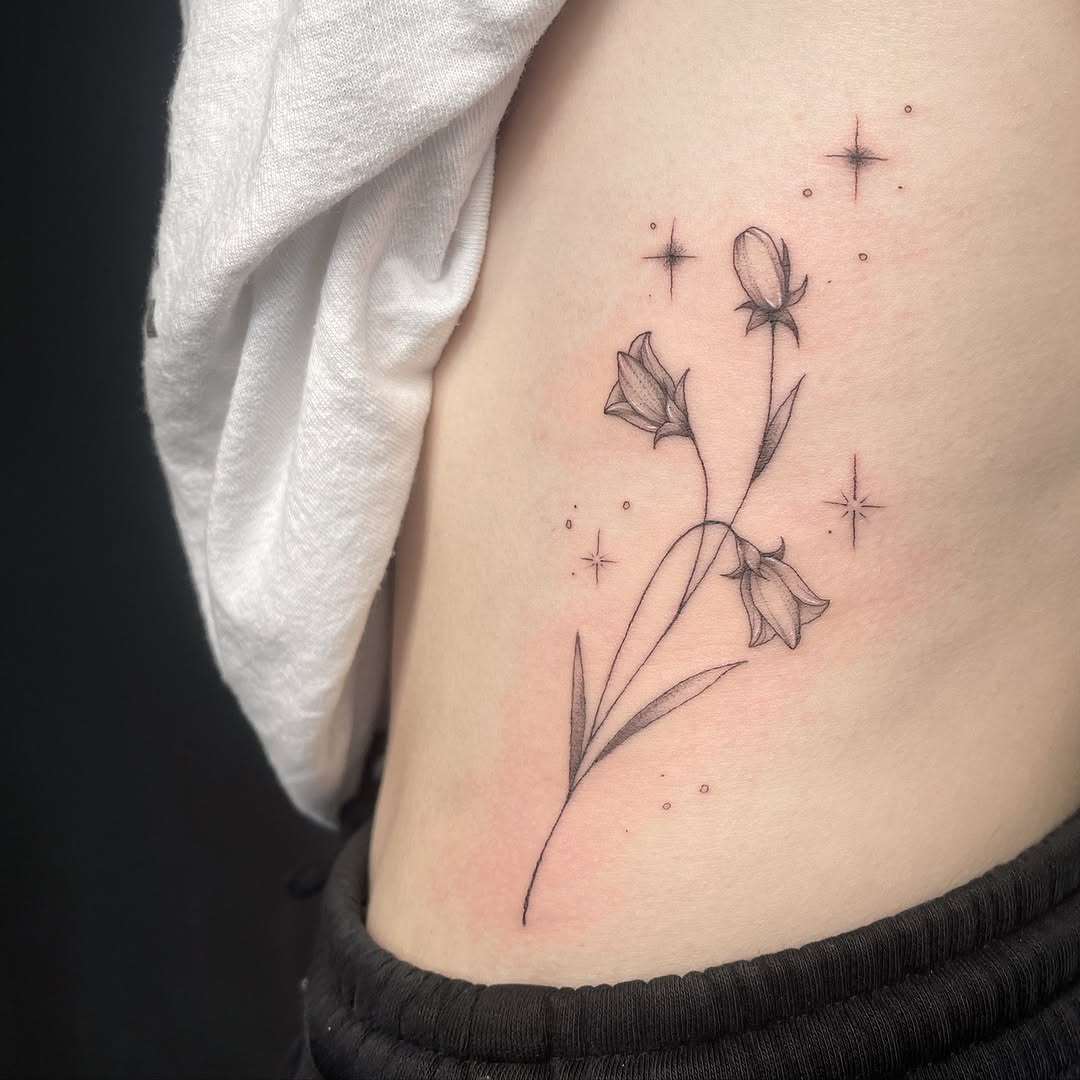 Elegant Floral Rib Tattoo Inspiration