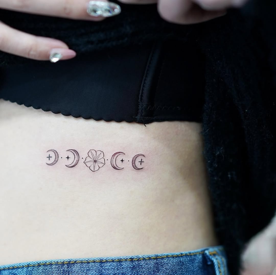 Elegant Rib Tattoo with Moon Phases