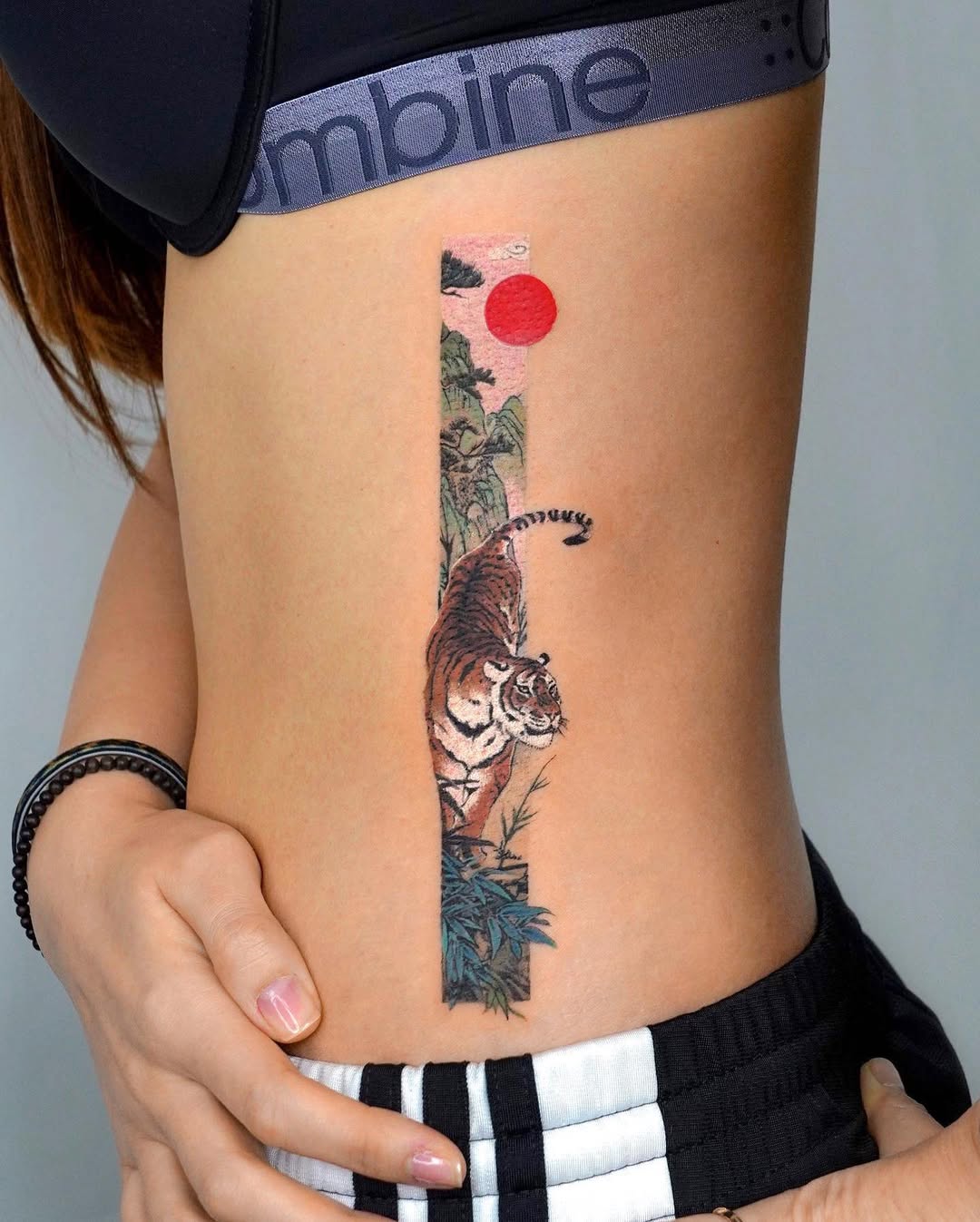 Stunning Rib Tattoo Featuring a Tiger Design