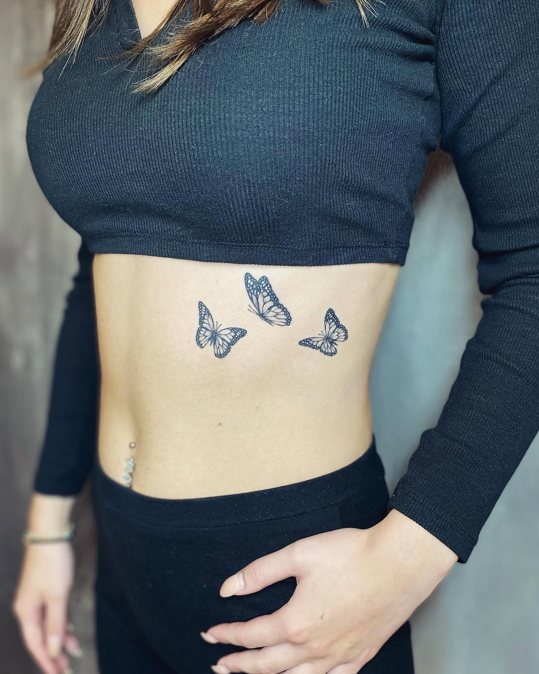 Elegant Butterfly Rib Tattoo Design for Women