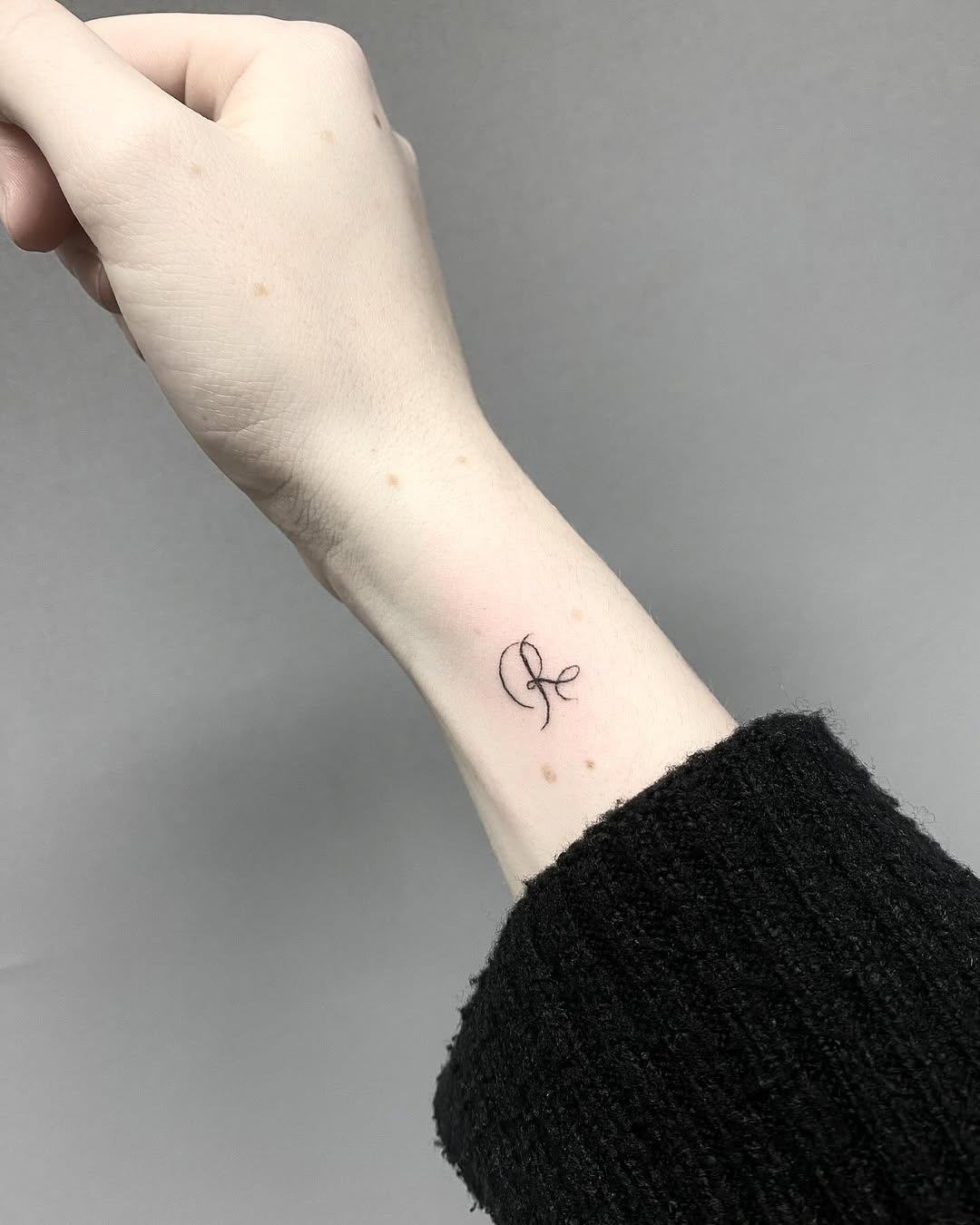 Minimalist Initials Tattoo on Wrist