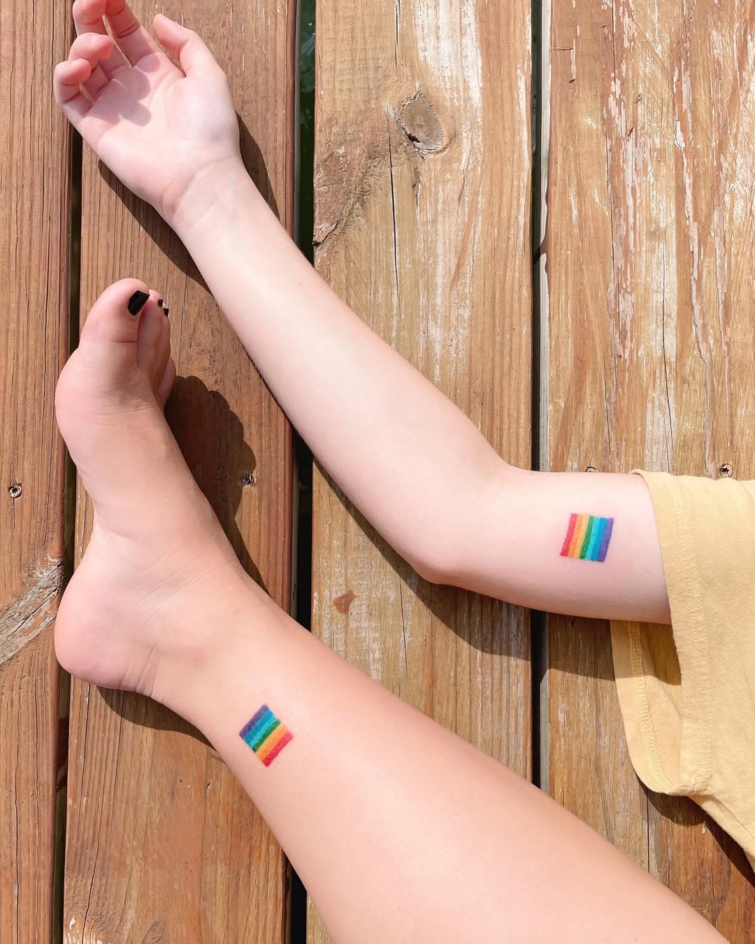 Colorful rainbow flags celebrating sisterhood.