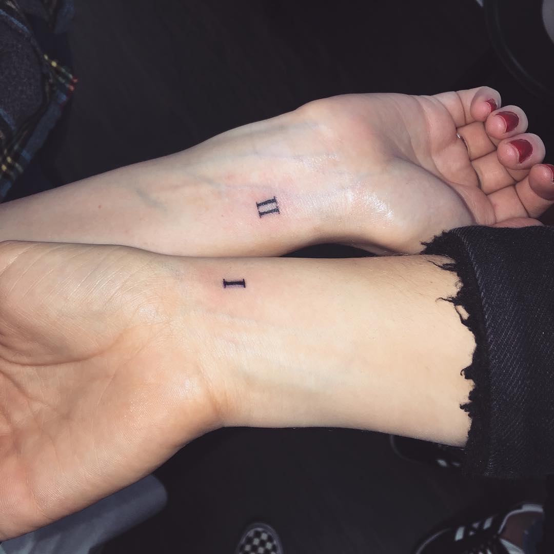 Minimalist sister tattoos symbolizing unity and love