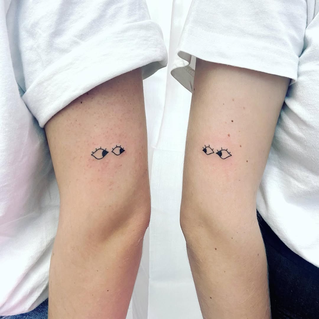 Minimalist eye tattoos for sister bond