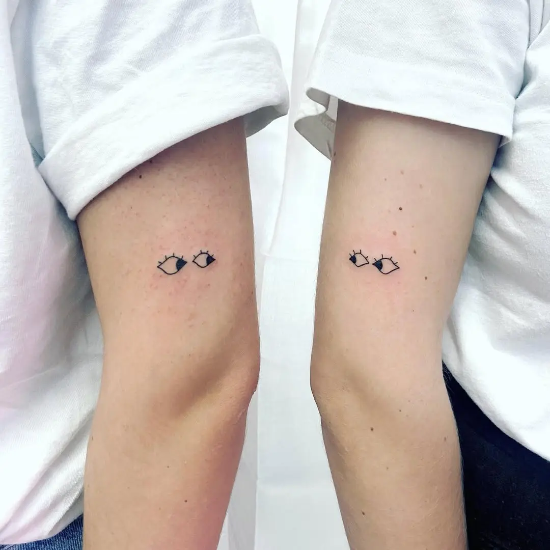 Minimalist eye tattoos for sister bond