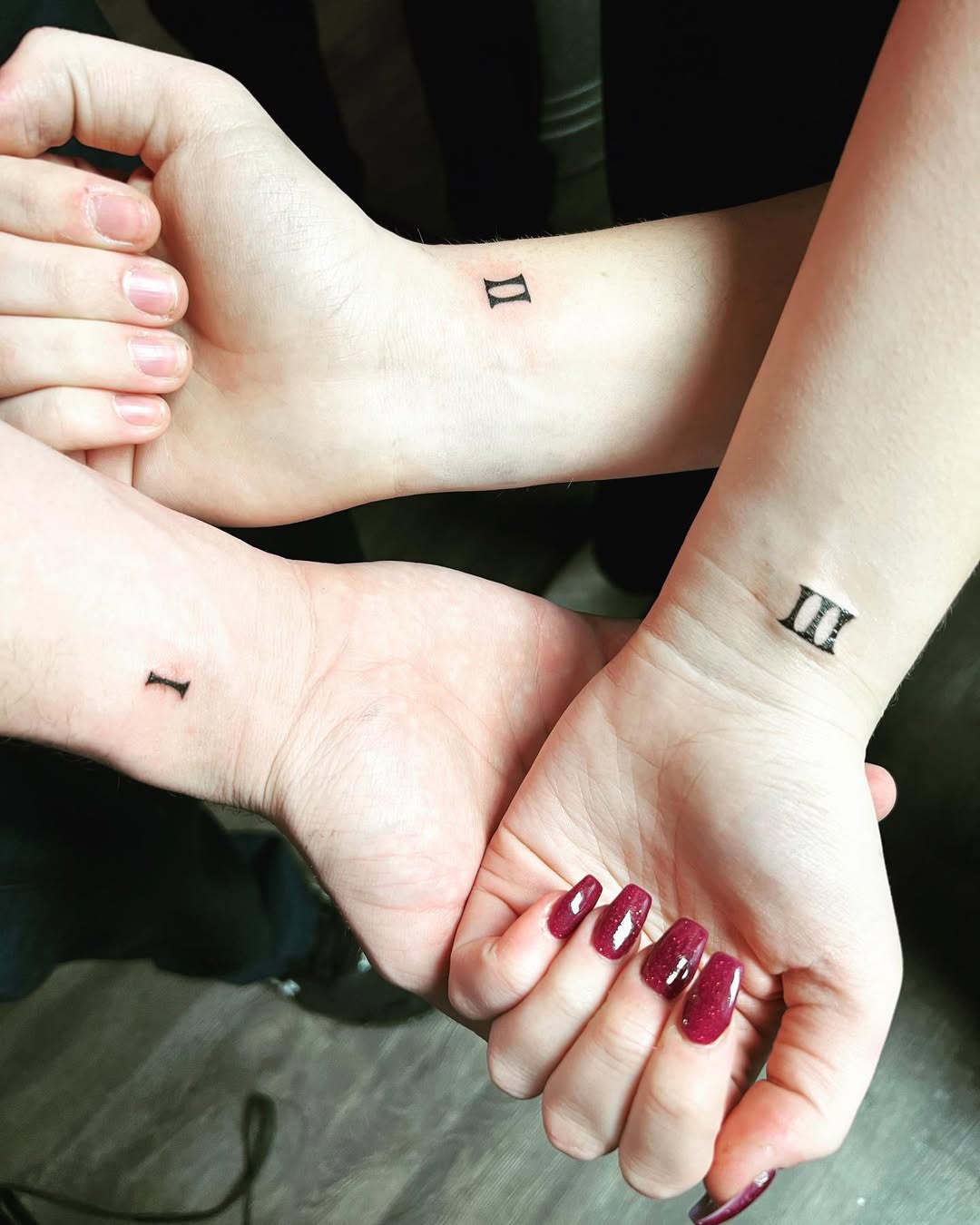 Minimalist Sister Tattoos with Numbers One and Three