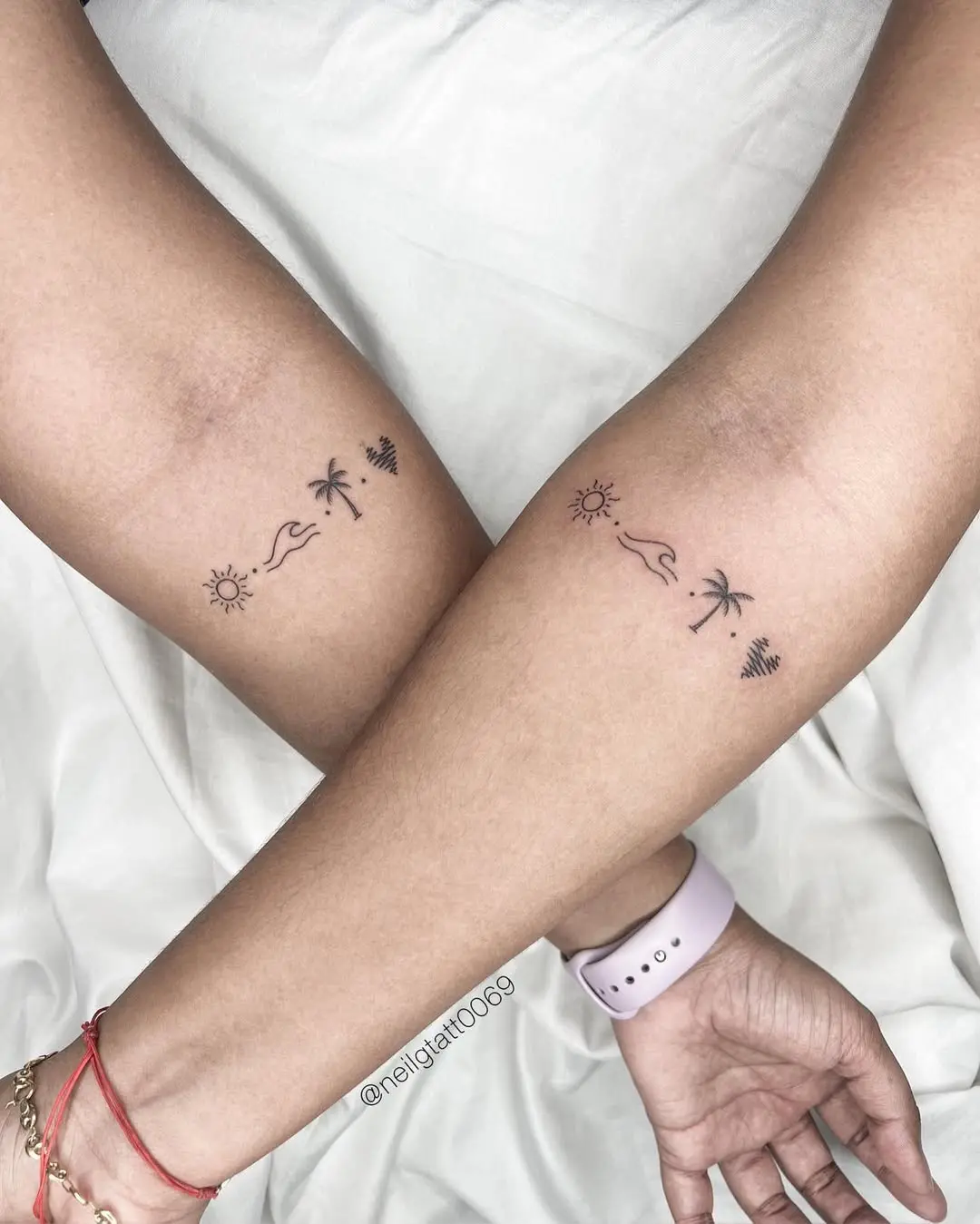 Charming sister tattoos of sun and palms