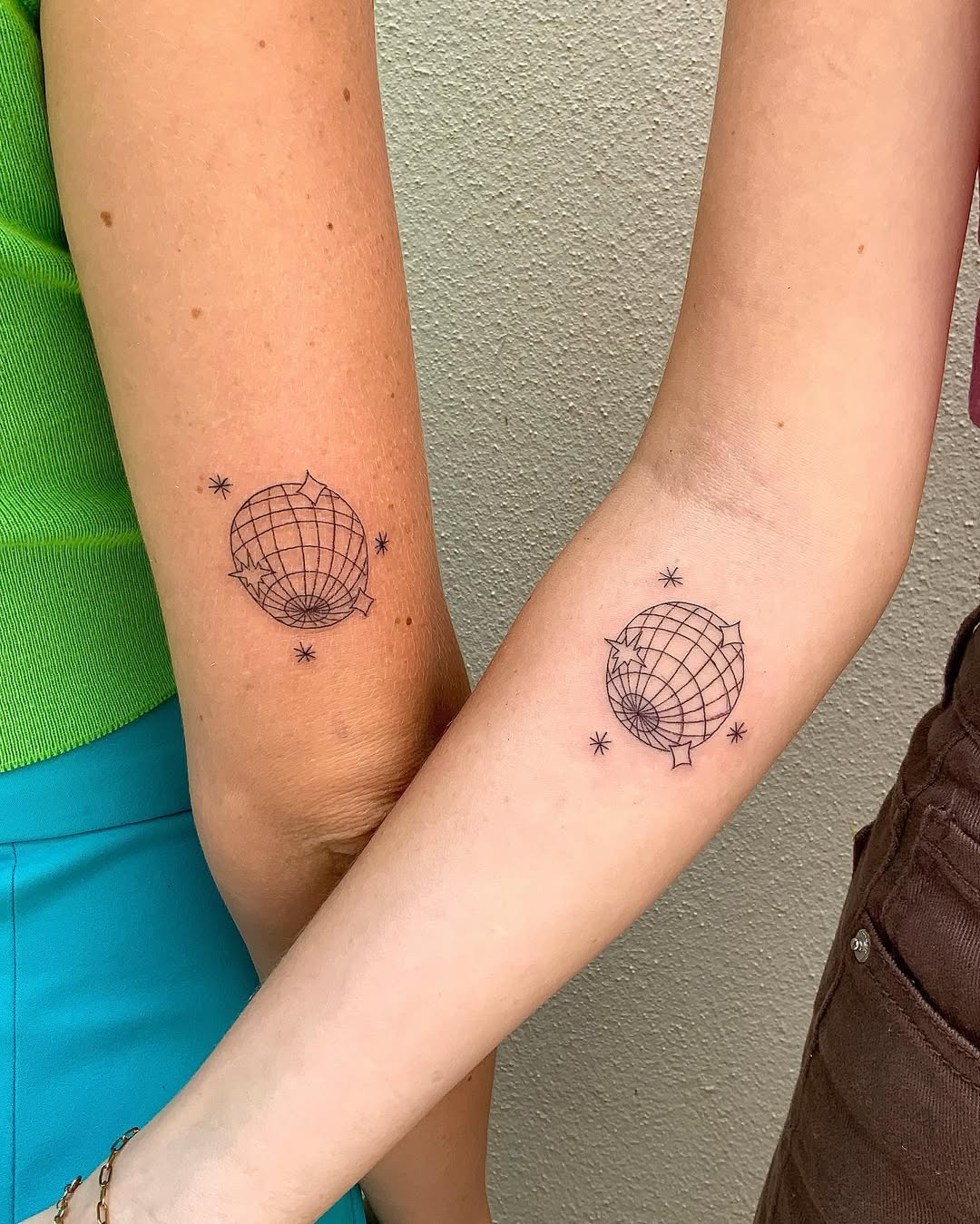 Minimalist Globe Tattoos Celebrating Sisterhood