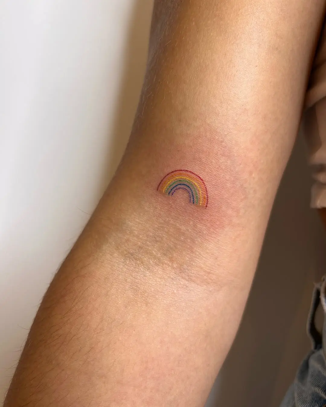 Charming Small Rainbow Tattoo on Arm