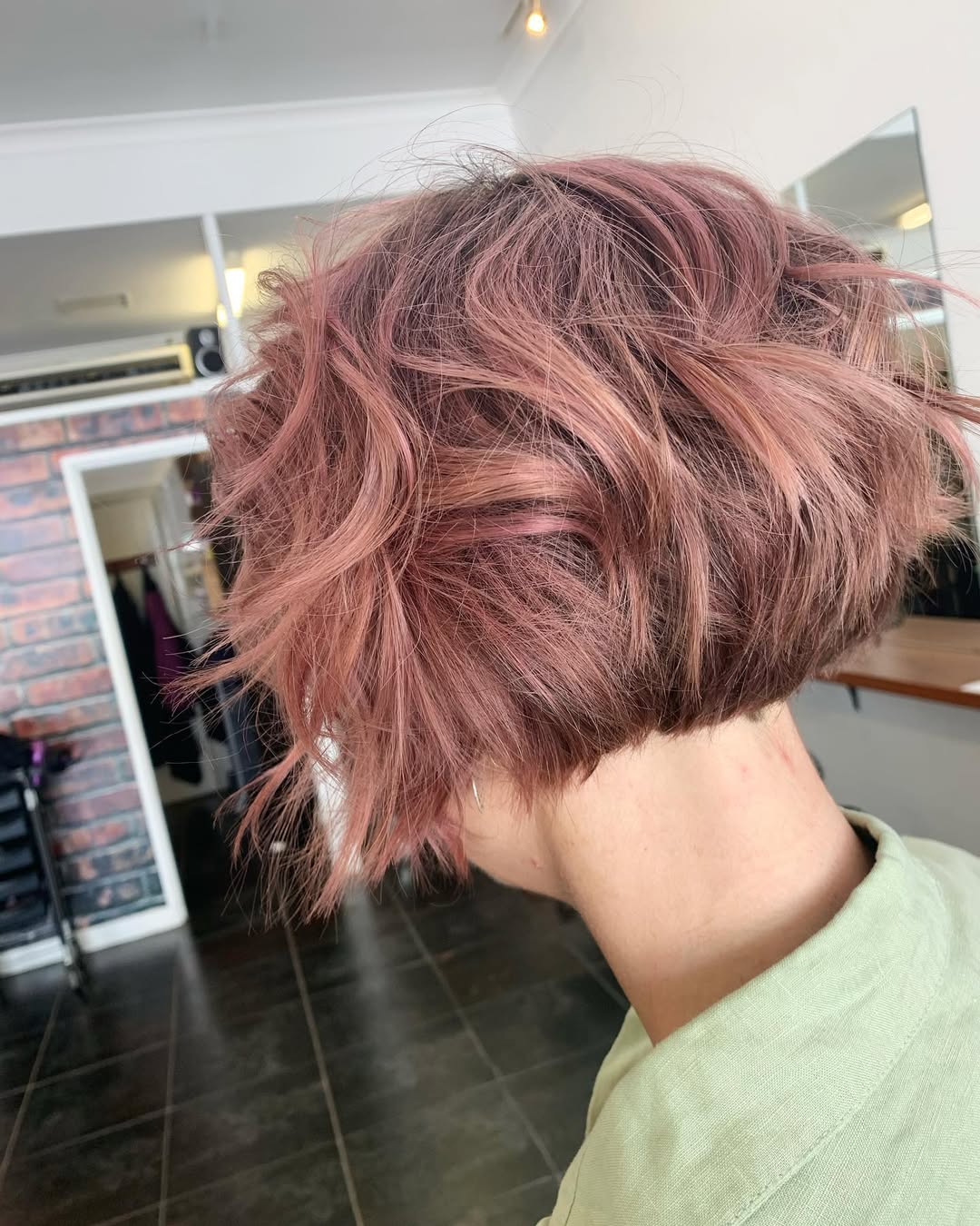 Chic pink pixie bob hairstyle for women