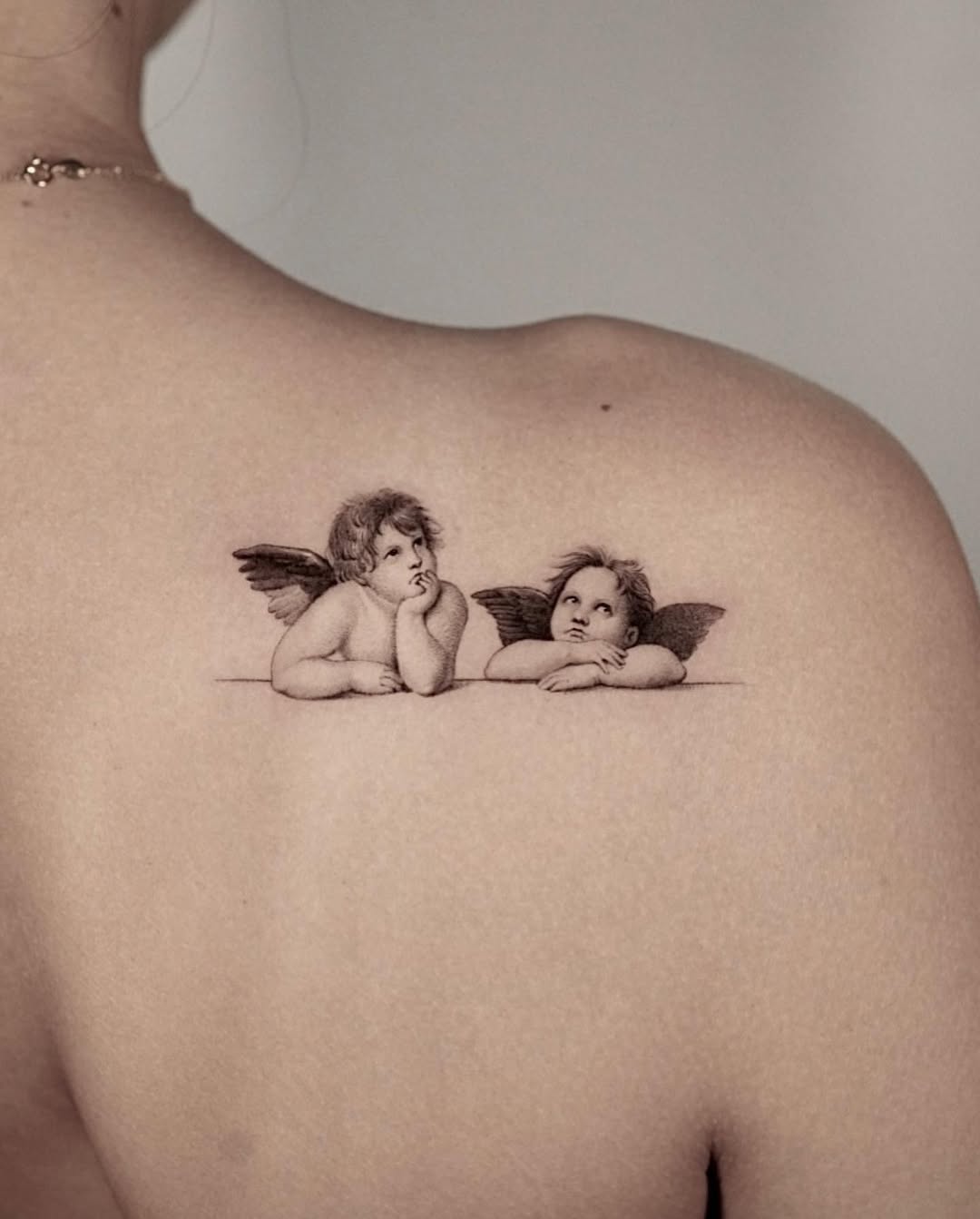 Charming Cherubs Tattoo on the Back