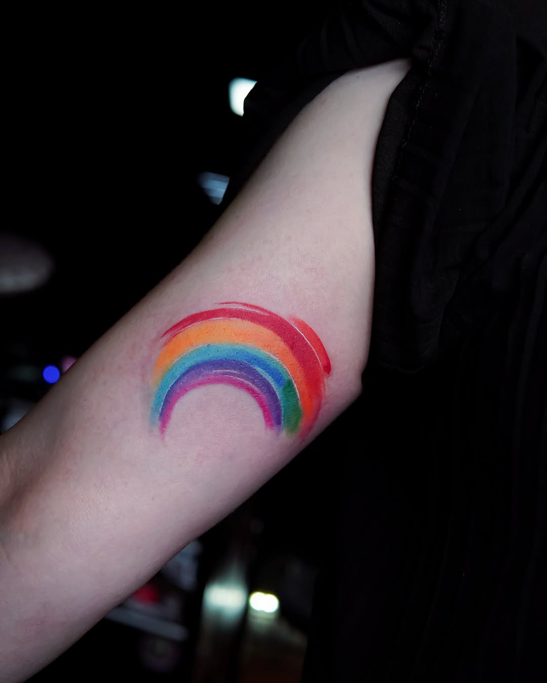 Vibrant Rainbow Tattoo on Arm