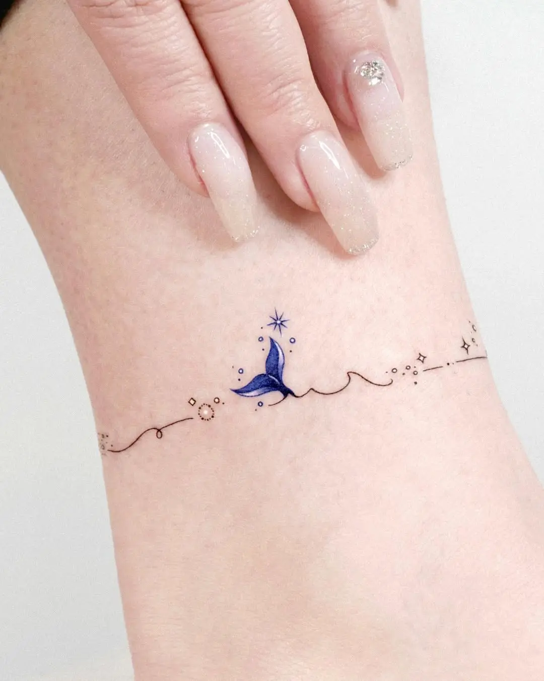 Charming Minimalist Whale Tattoo with Stars