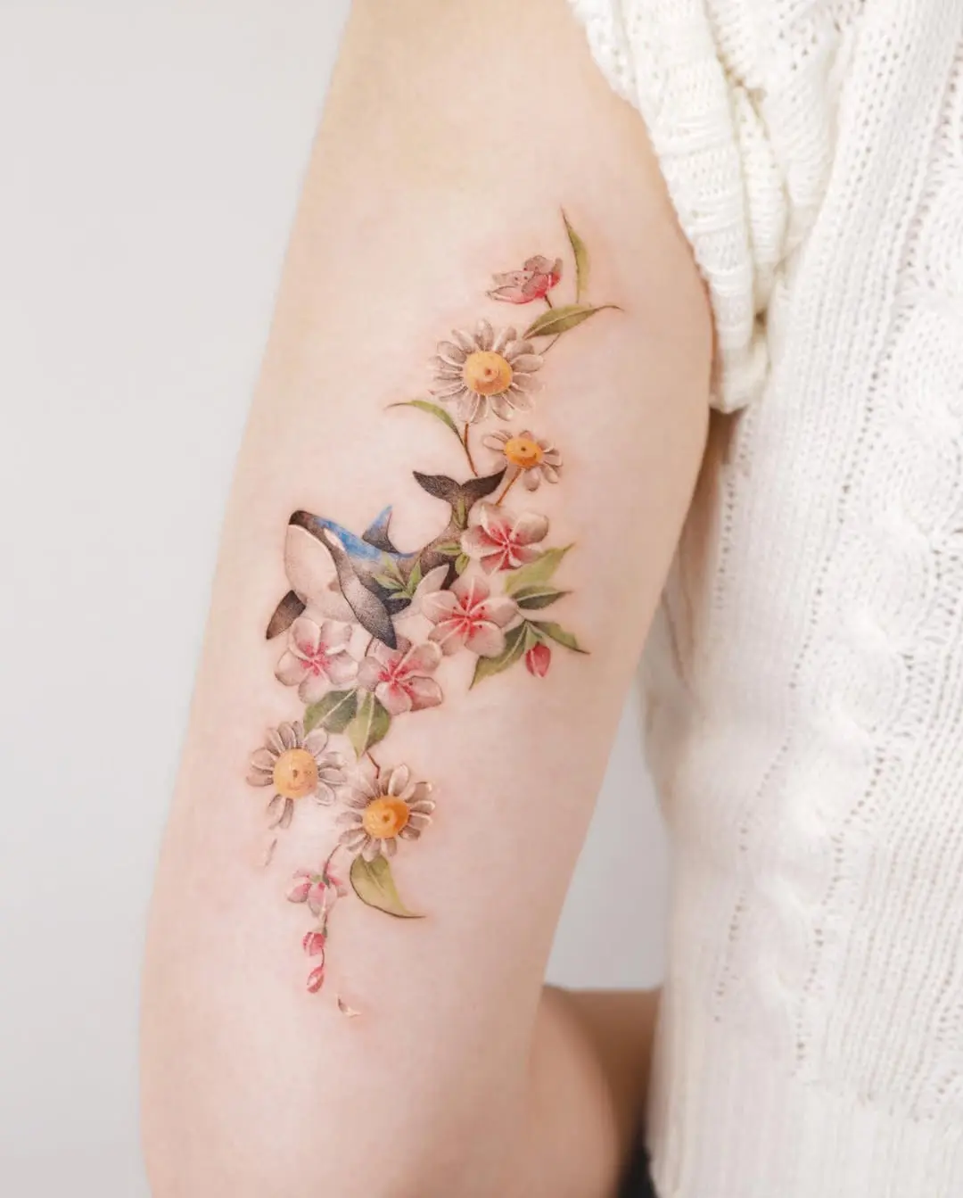 Whimsical whale amid floral embellishments