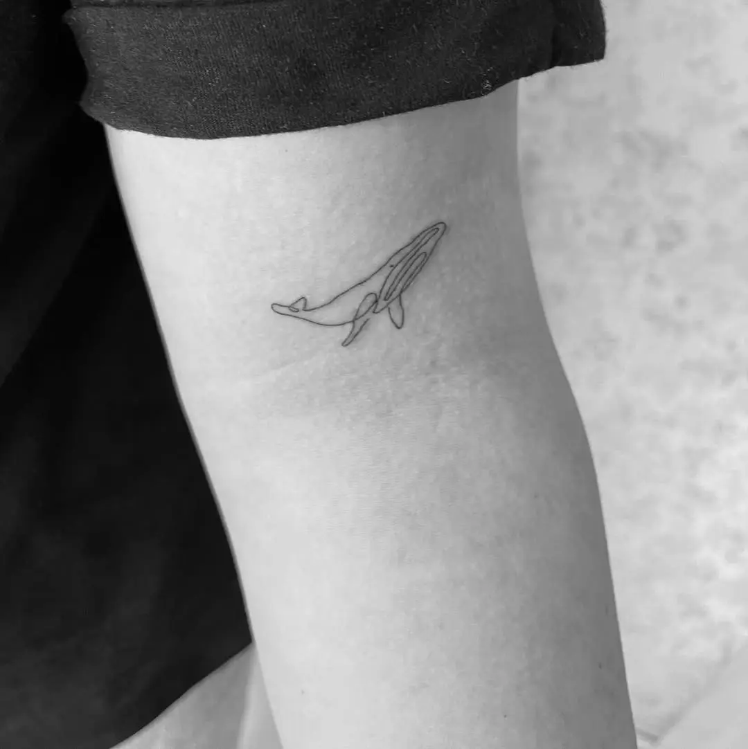 Chic Minimalist Whale Tattoo on Arm