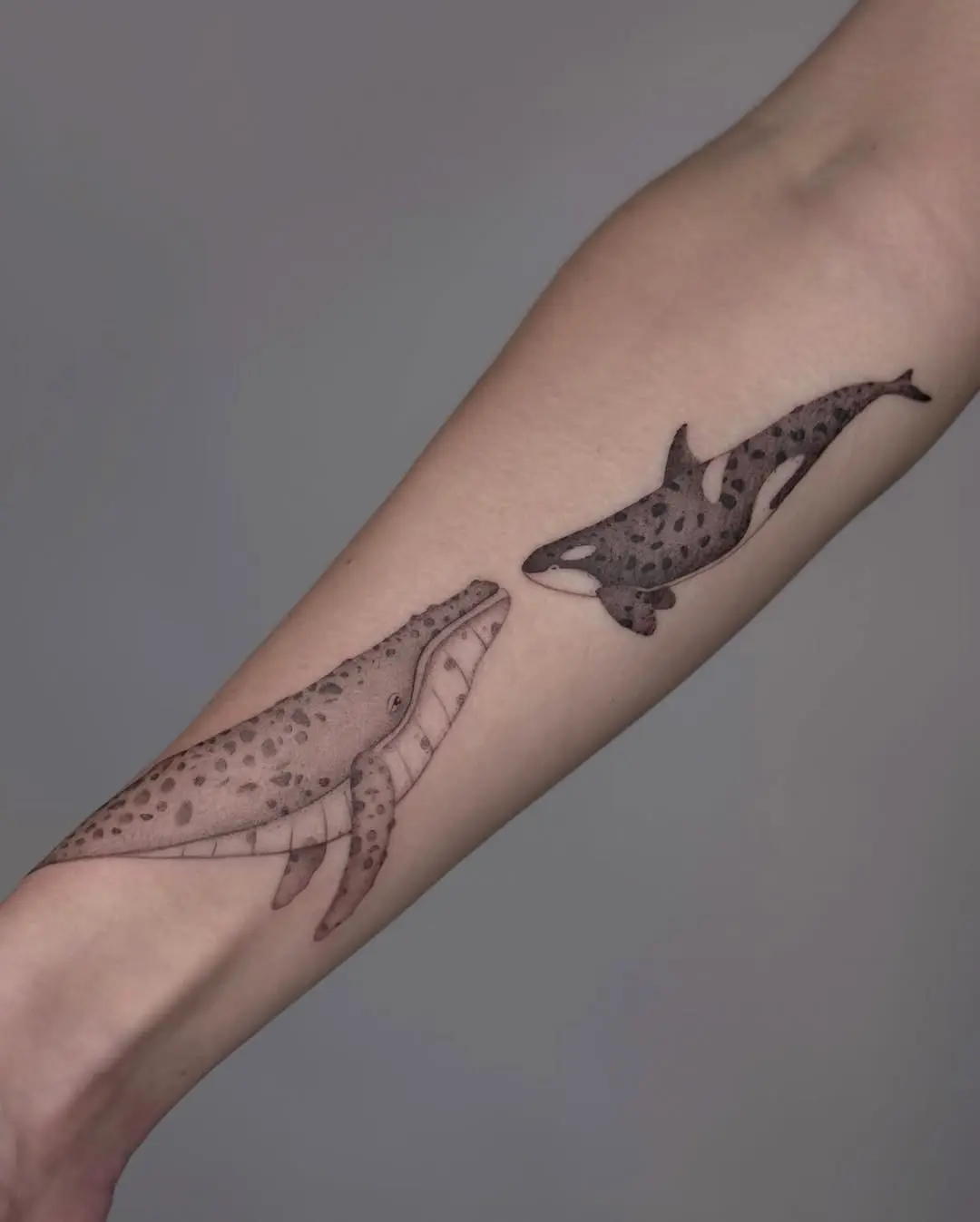 Elegant Minimalist Whale Tattoo for the Arm