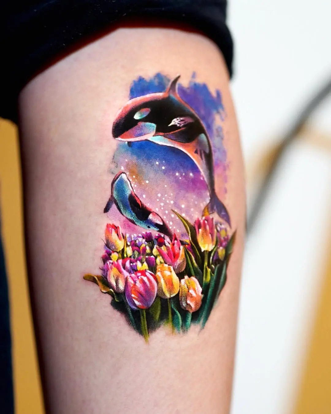 Vibrant Orca Tattoo Surrounded by Flowers