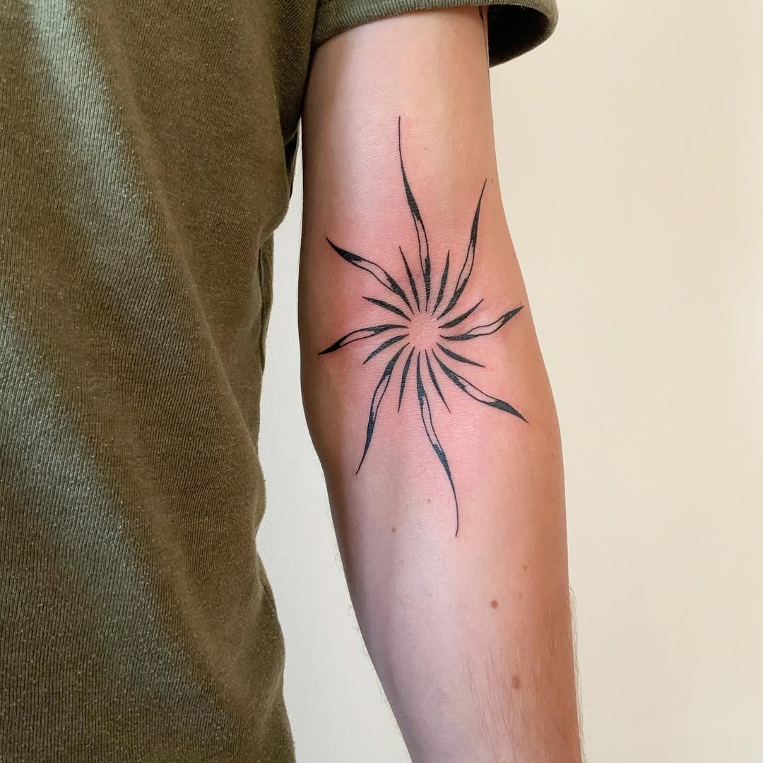 Elegant minimalist star tattoo on the arm