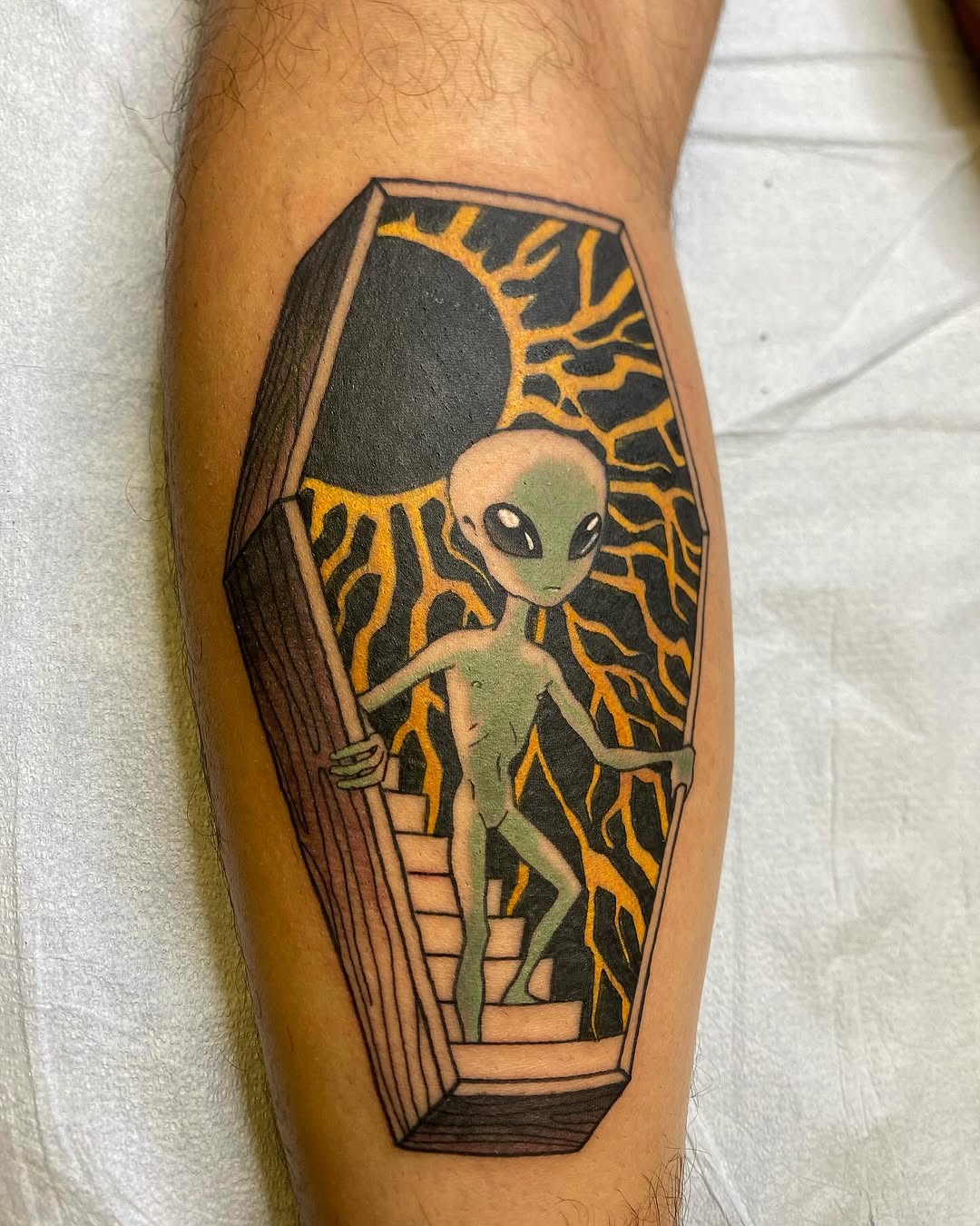 Fascinating alien tattoo with a playful vibe.