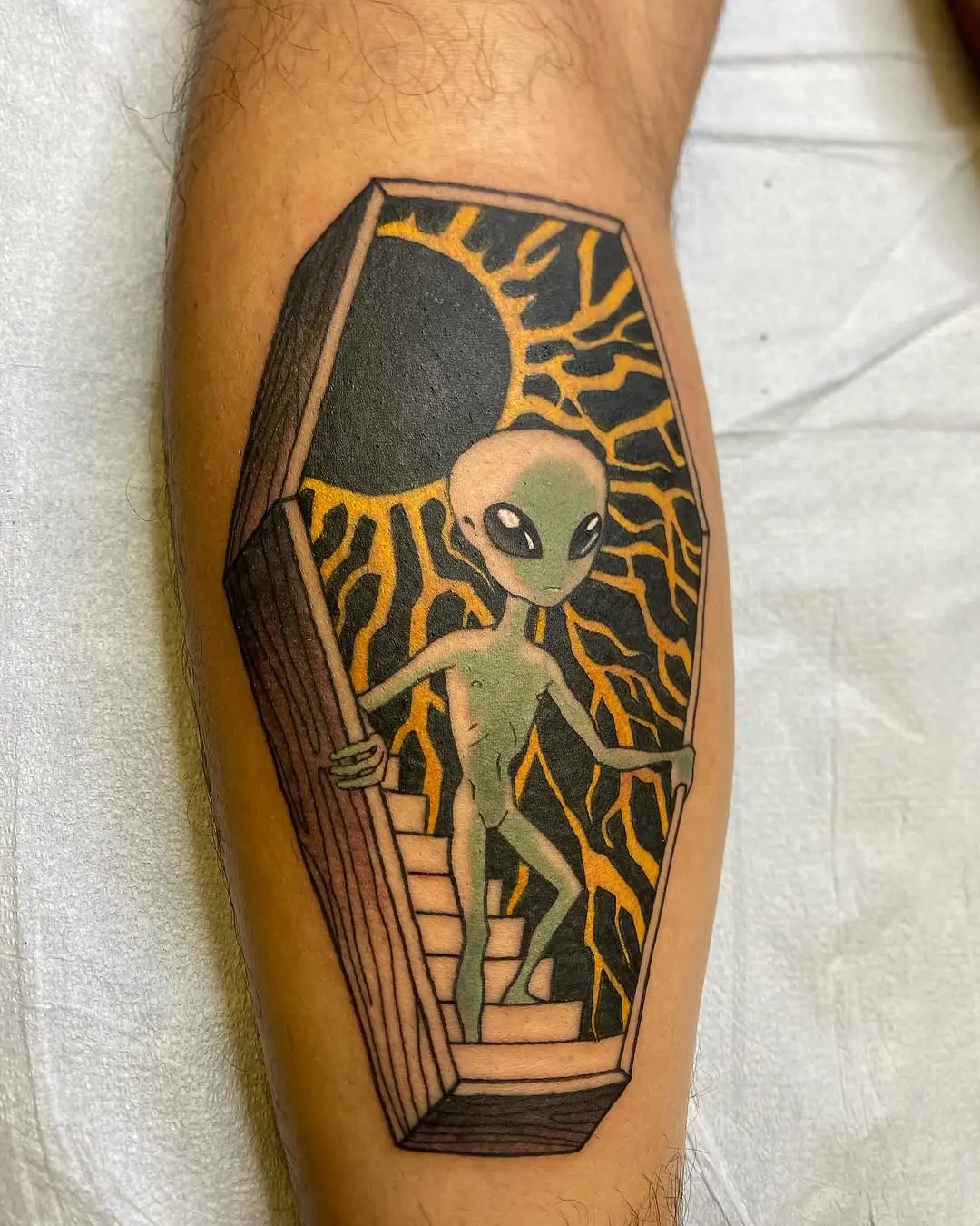 Fascinating alien tattoo with a playful vibe.