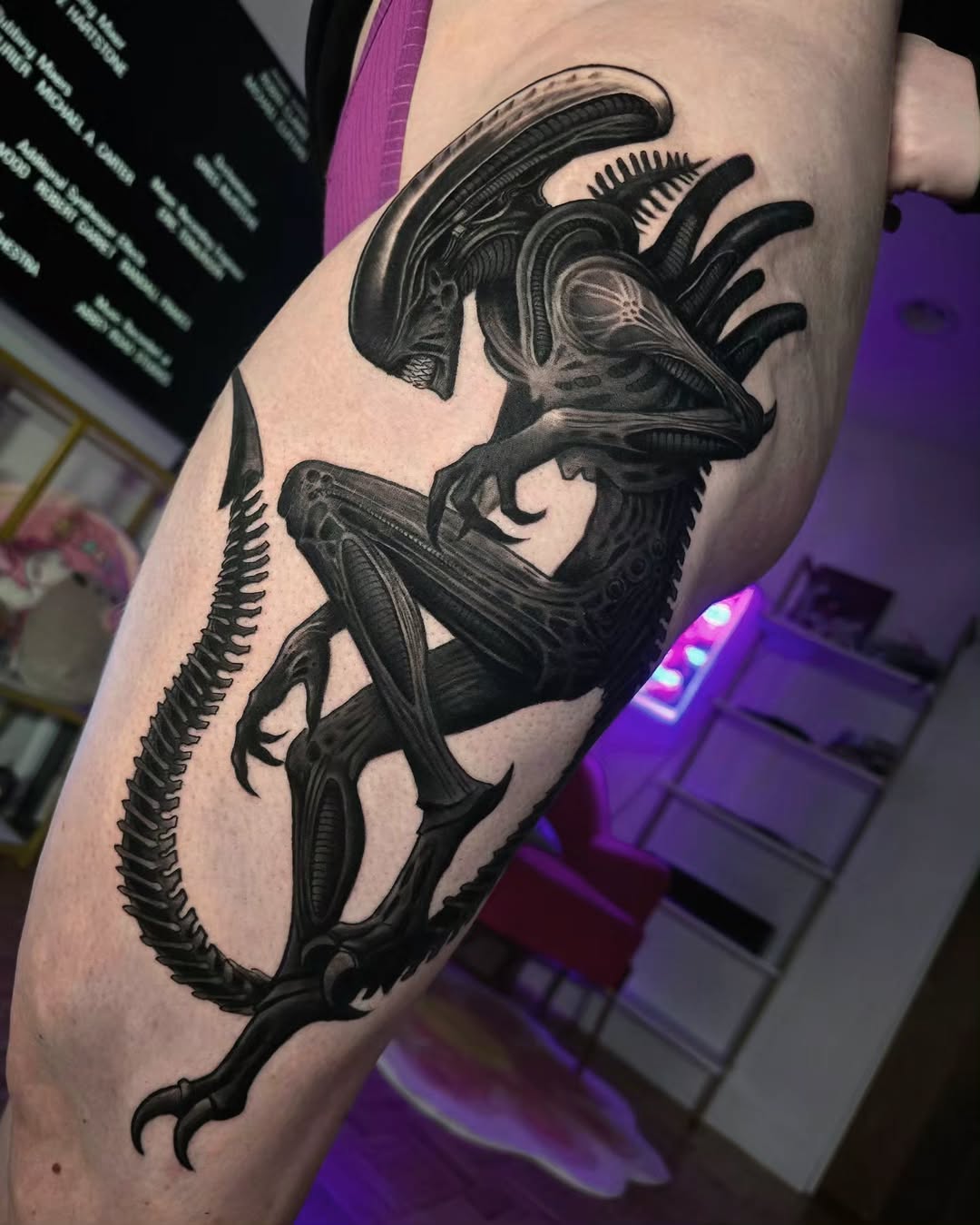 Intricate blackwork of a sci-fi alien creature