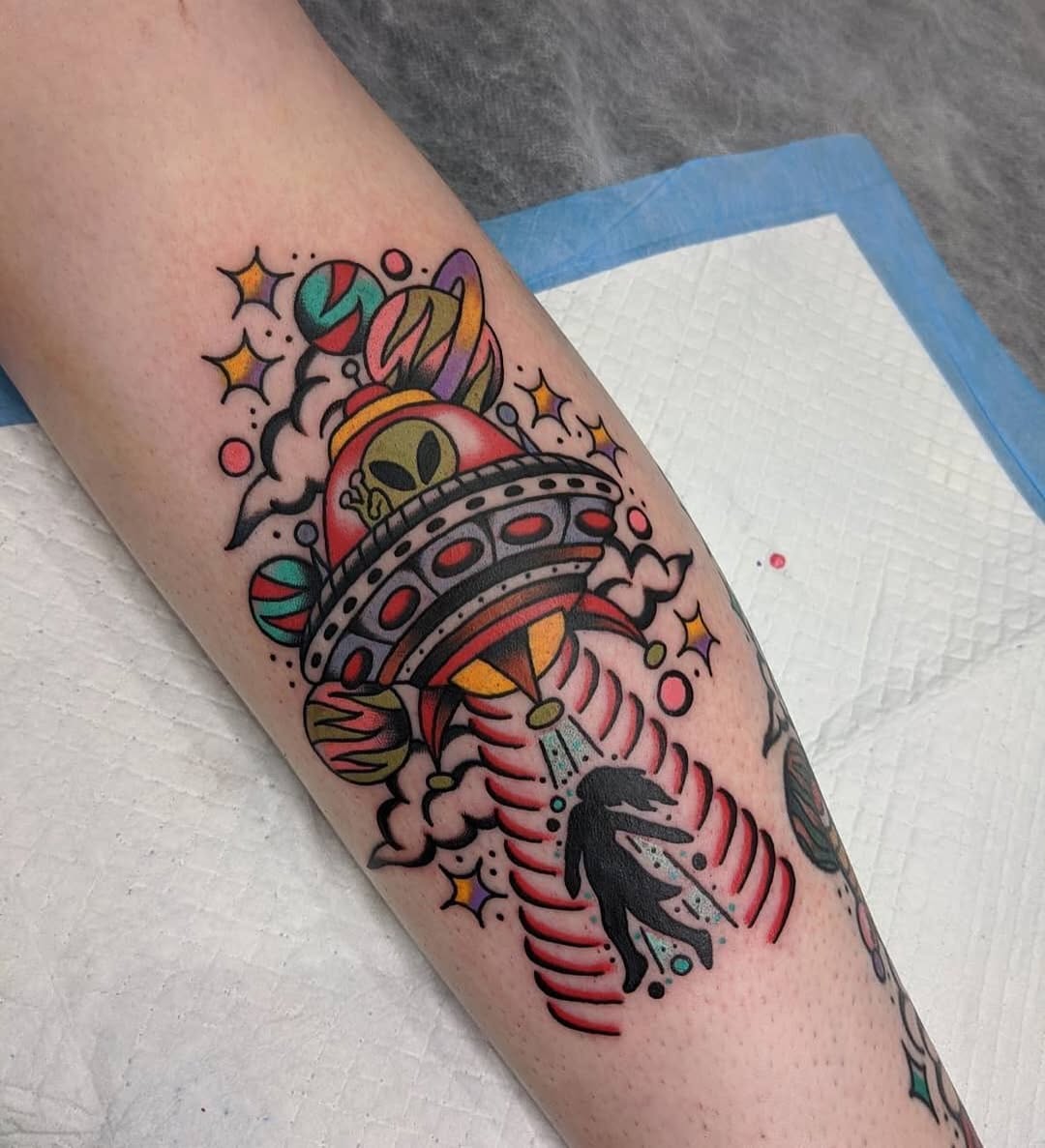 Colorful UFO Tattoo with Vibrant Alien Elements