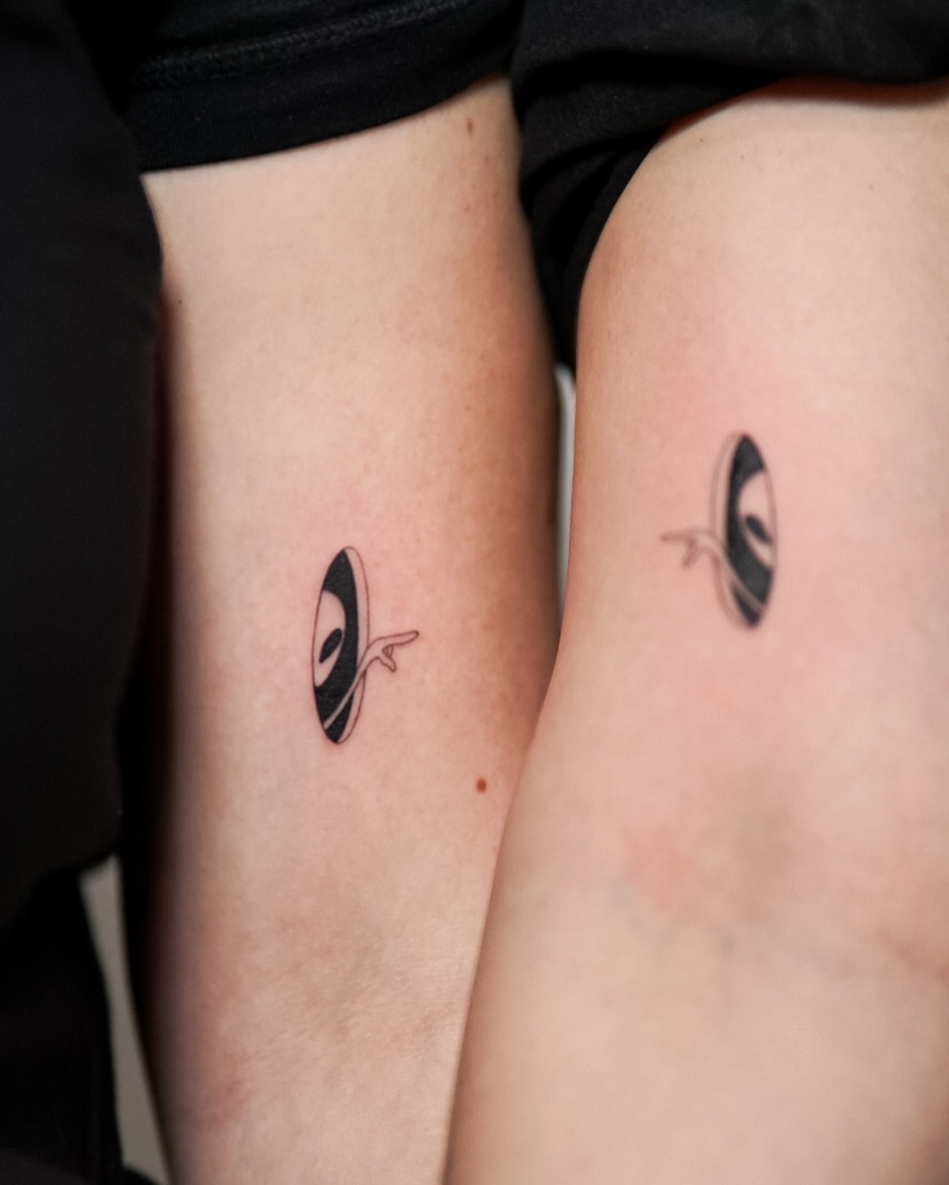 Unique minimalist alien tattoos on arms