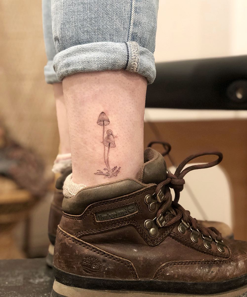 Elegant mushroom tattoo on ankle showcases nature's beauty