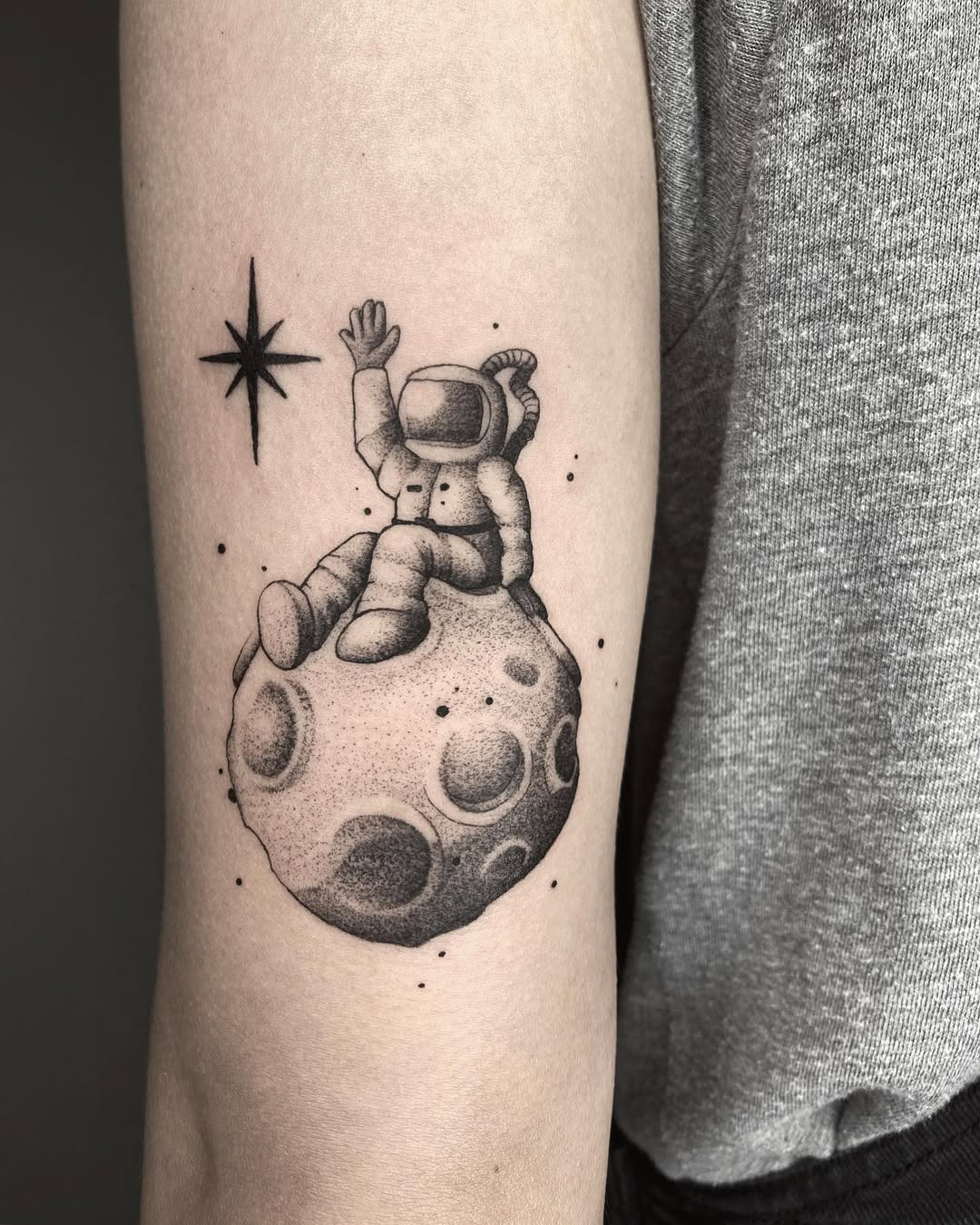 Whimsical astronaut tattoo with celestial vibes