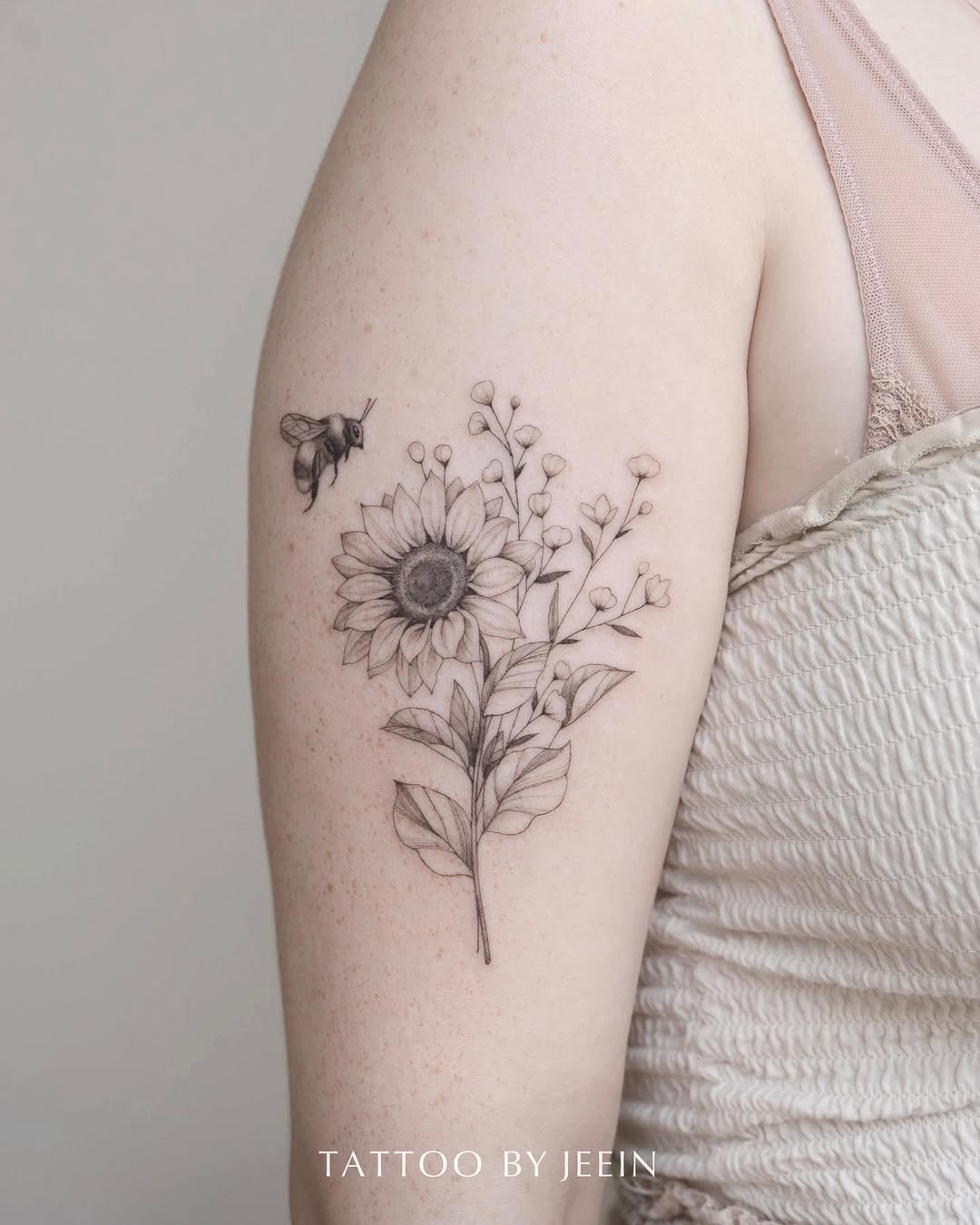 Elegant Minimalist Bee and Flower Tattoo Design