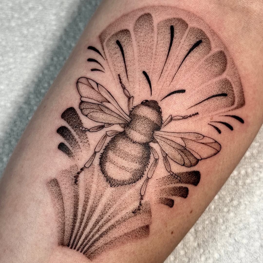 Elegant black and grey bee tattoo design