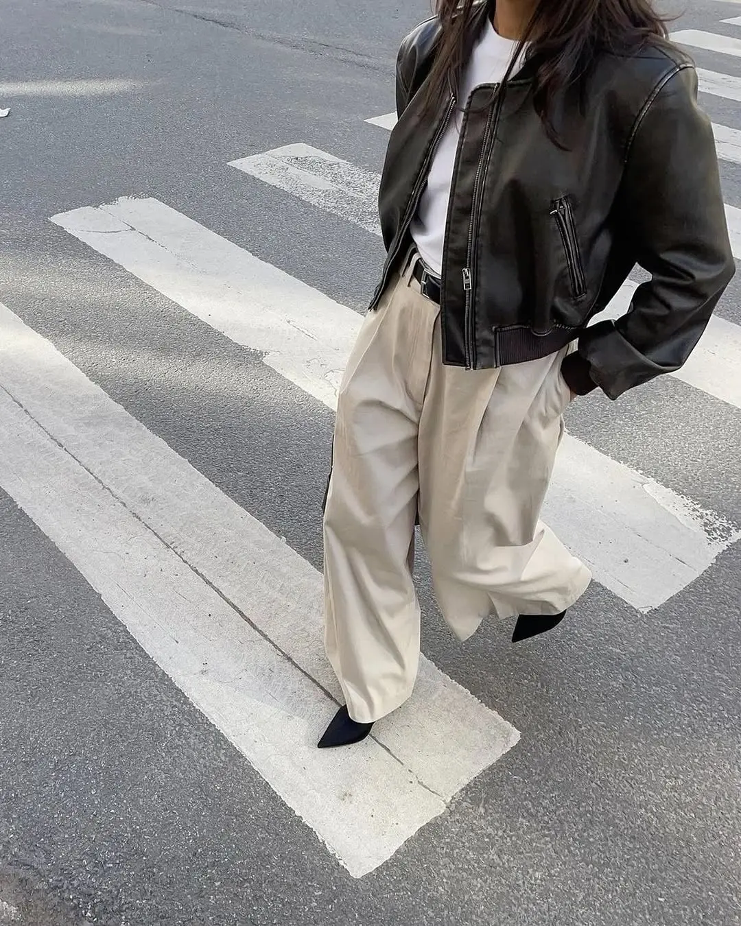 Chic biker jacket paired with wide trousers
