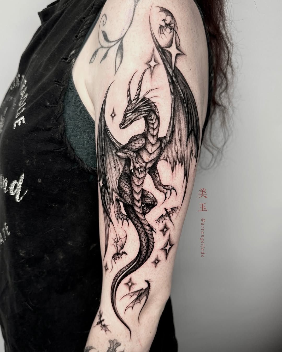 Intricate dragon tattoo with celestial elements