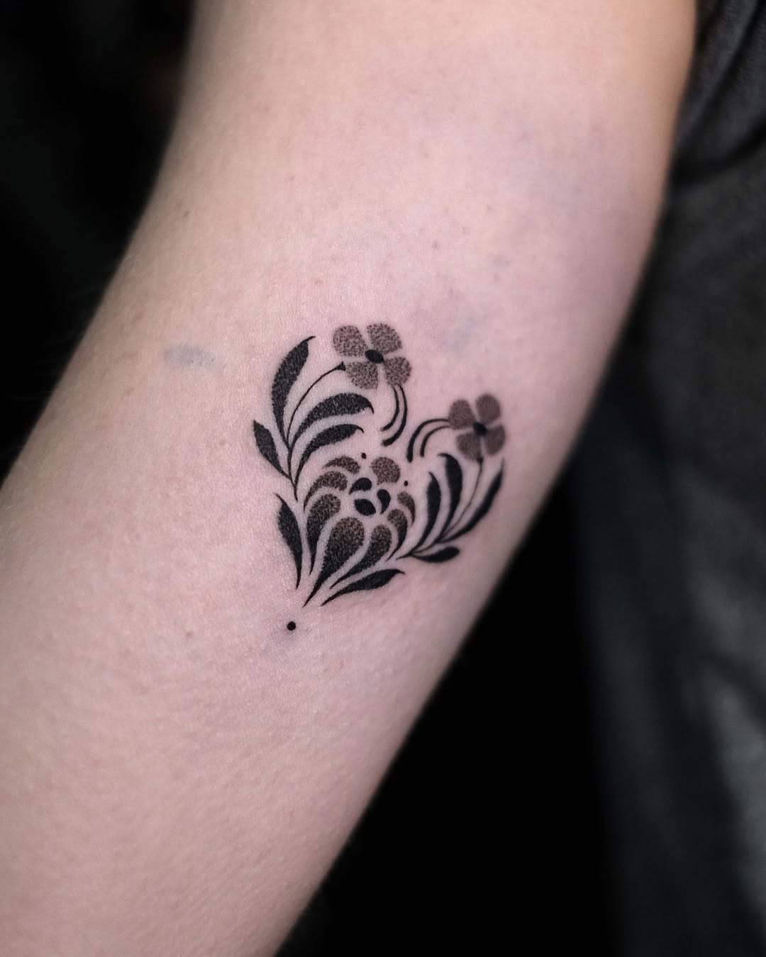 Elegant floral heart tattoo with intricate details